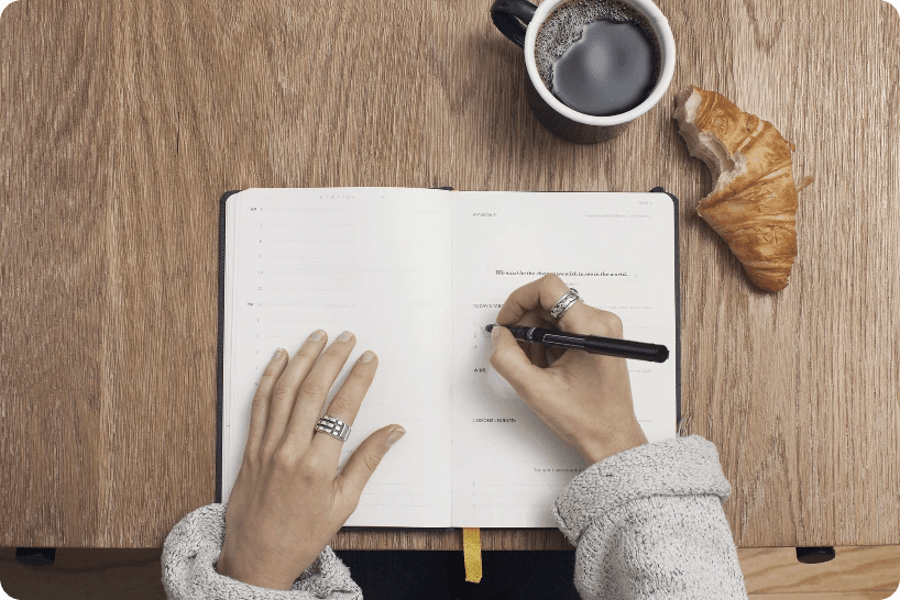 Person writing in a notebook